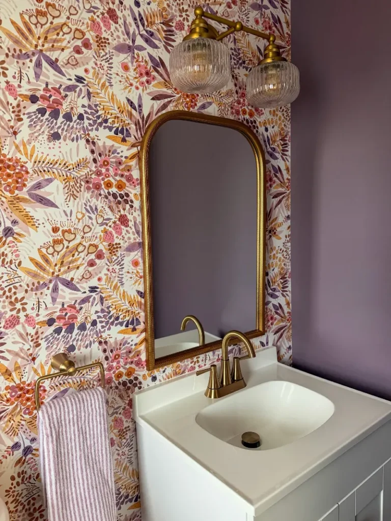 1. Arched Gold Mirror Vanity with Wildflower Peel and Stick Accent Wall