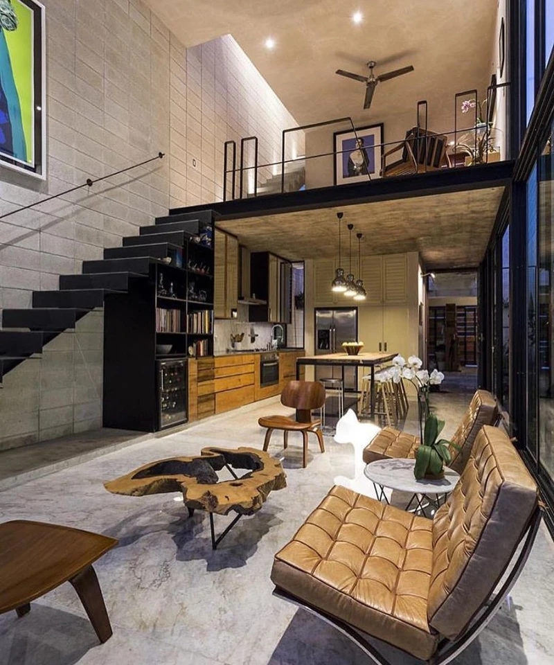 1. Black Steel Loft Staircase with Tan Leather Lounge Chairs and Live Edge Coffee Table