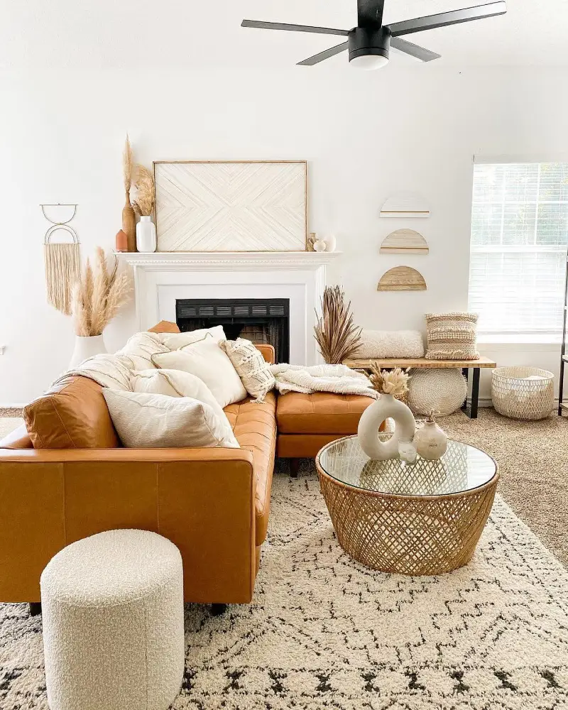 1. Neutral Layered Rug Over Beige Rental Carpet with Tan Sectional Sofa