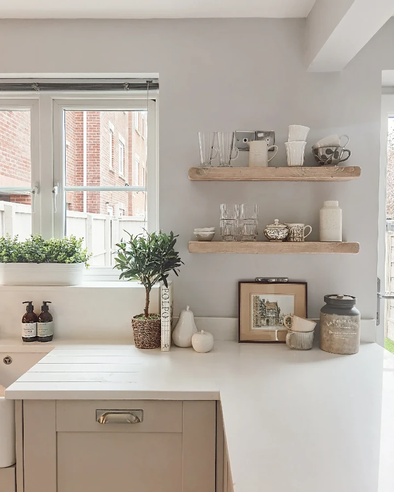 1. Pale Wood Kitchen Shelves with Cream Ceramics and Glass Mugs