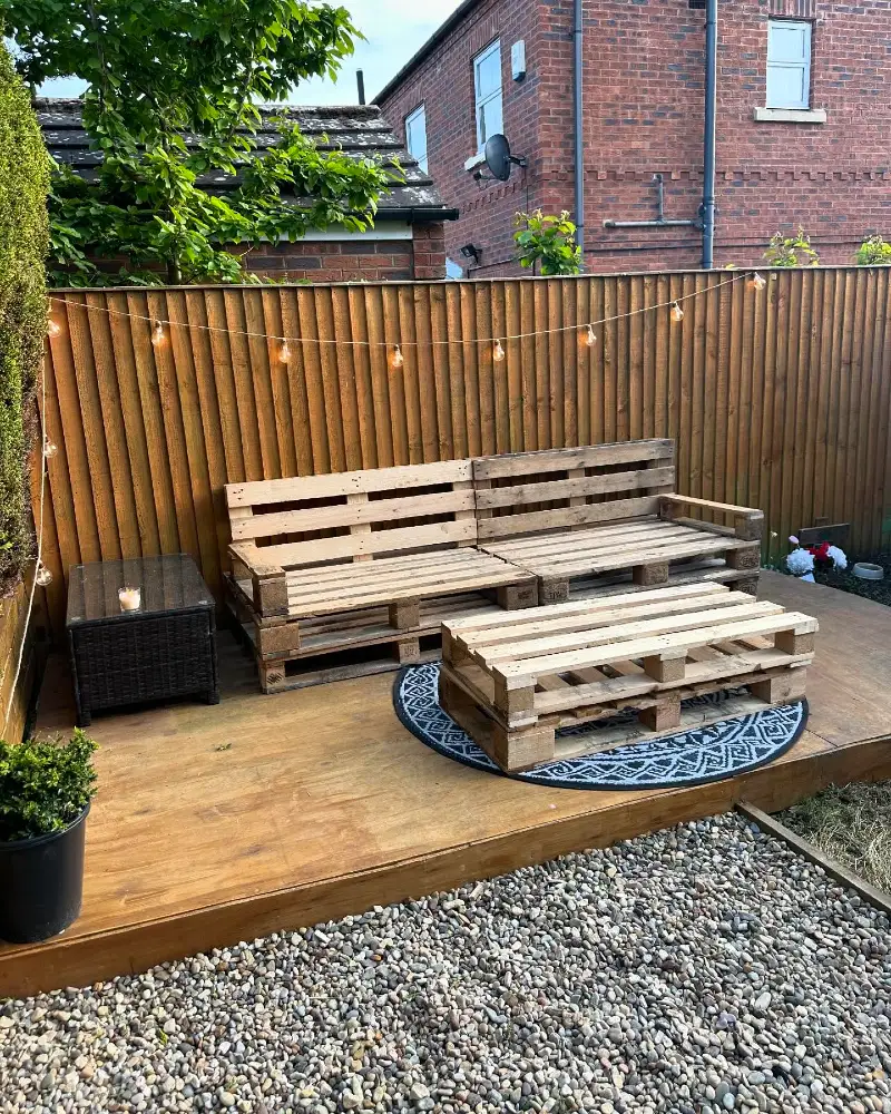 1. Pallet Sofa Bench with Matching Low Coffee Table and String Lights