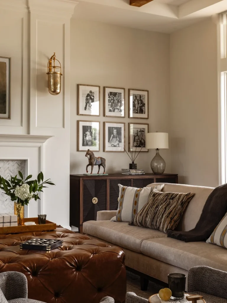 10. Tufted Leather Ottoman with Family Photo Grid and Dark Wood Cabinet
