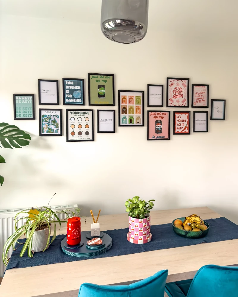 11. Kitchen Typography Gallery Wall Above Dining Table with Clean Black Frames