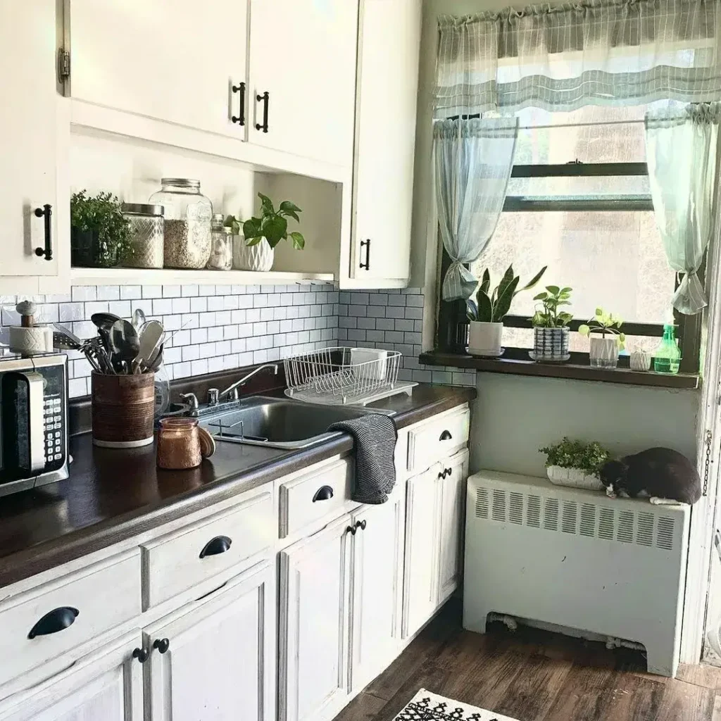 11. White Cottage Cabinets with Dark Wood Counter and Window Herb Nook