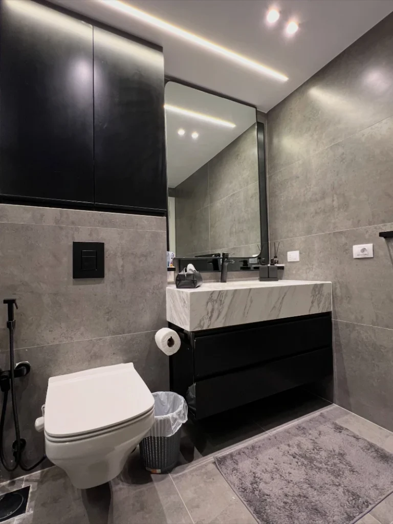 12. Charcoal Tile Bathroom with Black Floating Vanity
