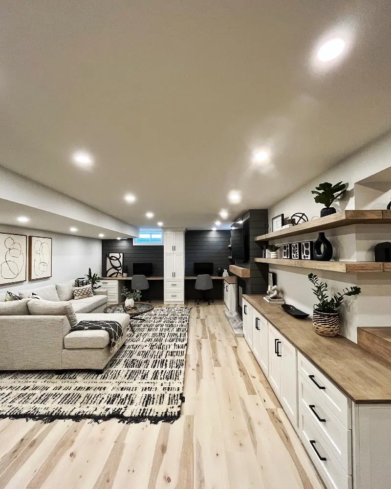 12. Long Cream Sectional with Graphic Monochrome Rug and Dual Built-in Home Office Desks