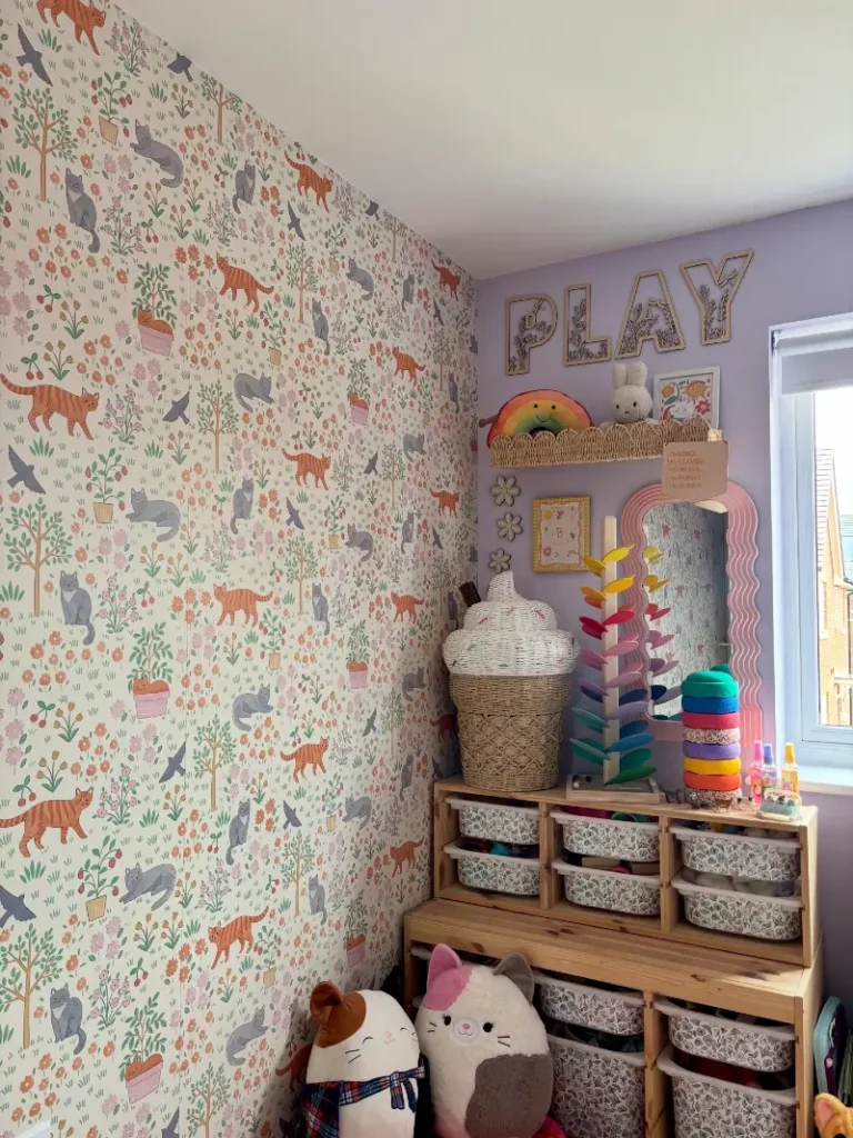 12. Playful Cat-Themed Storage Wall with Modular Toy Drawers and Soft Pastel Display