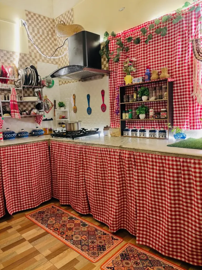 12. Red Gingham Covered Kitchen with Patterned Pantry Wall and Open Rustic Shelving