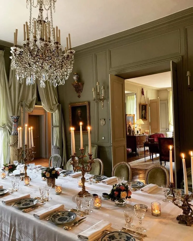 12. Sage Green Dining Room with Crystal Chandelier and Candlelit Table
