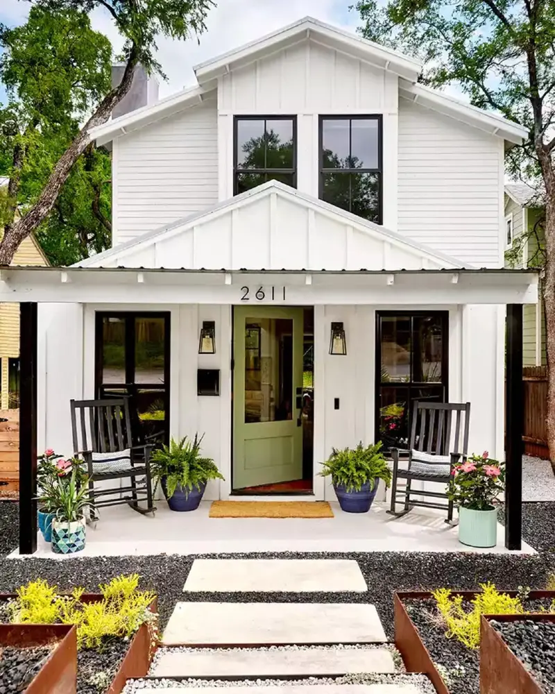 12. White Farmhouse Porch with Sage Door, Black Gravel, and Raised Planting Boxes