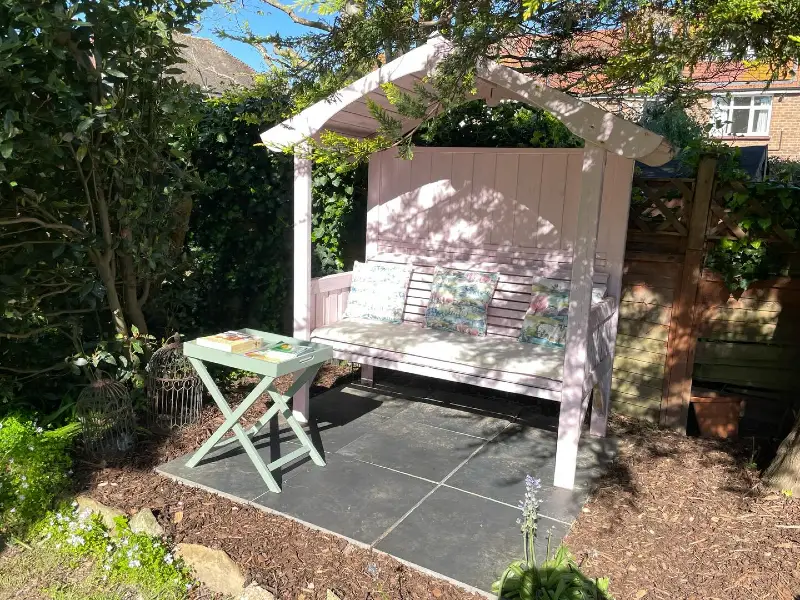 13. Blush Pink Garden Arbour Bench with Botanical Cushions and Slate Paving
