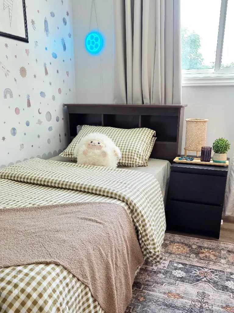 13. Olive Gingham Bed with Blue Wall Light and Space Pattern Wallpaper