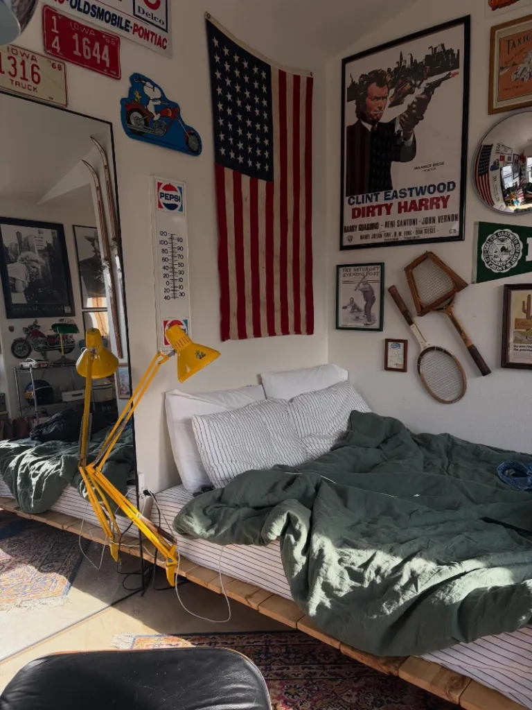 14. Vintage Americana Bedroom with Gallery Wall, Green Bedding, and Yellow Task Lamp