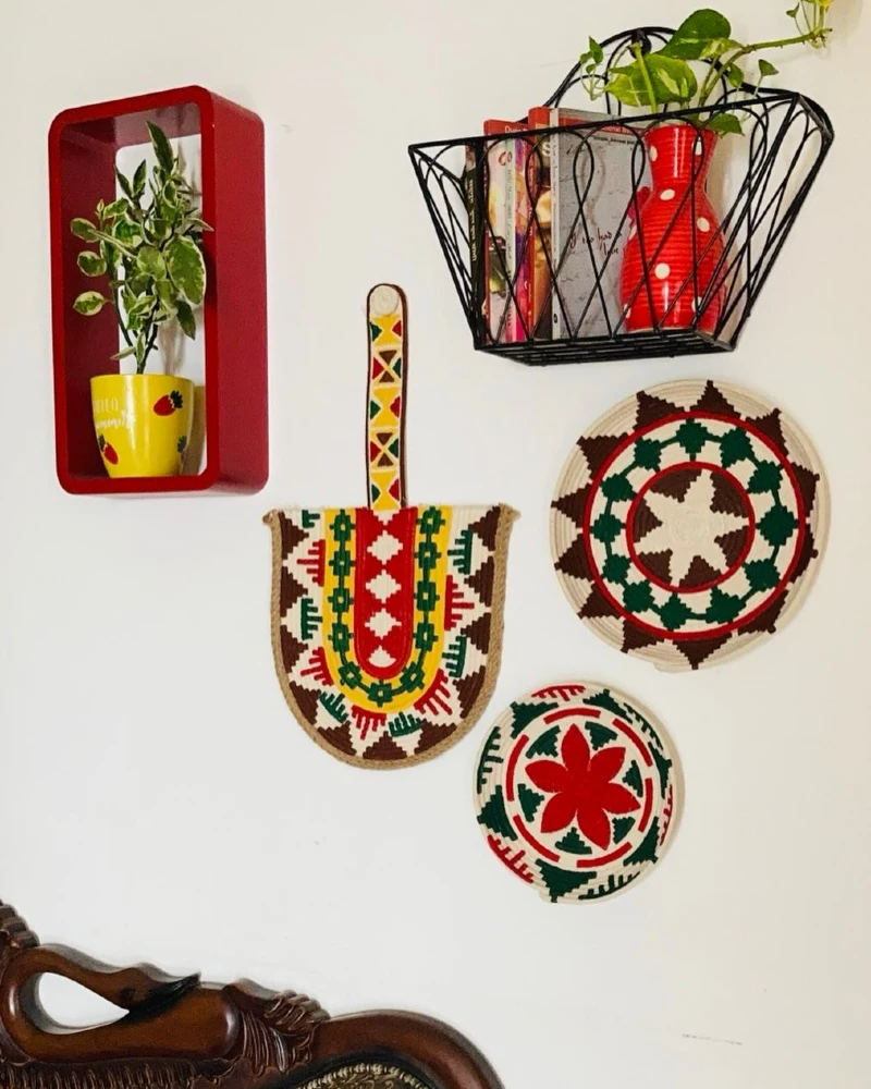 15. Color Pop Craft Wall with Woven Trays and Floating Storage Pieces