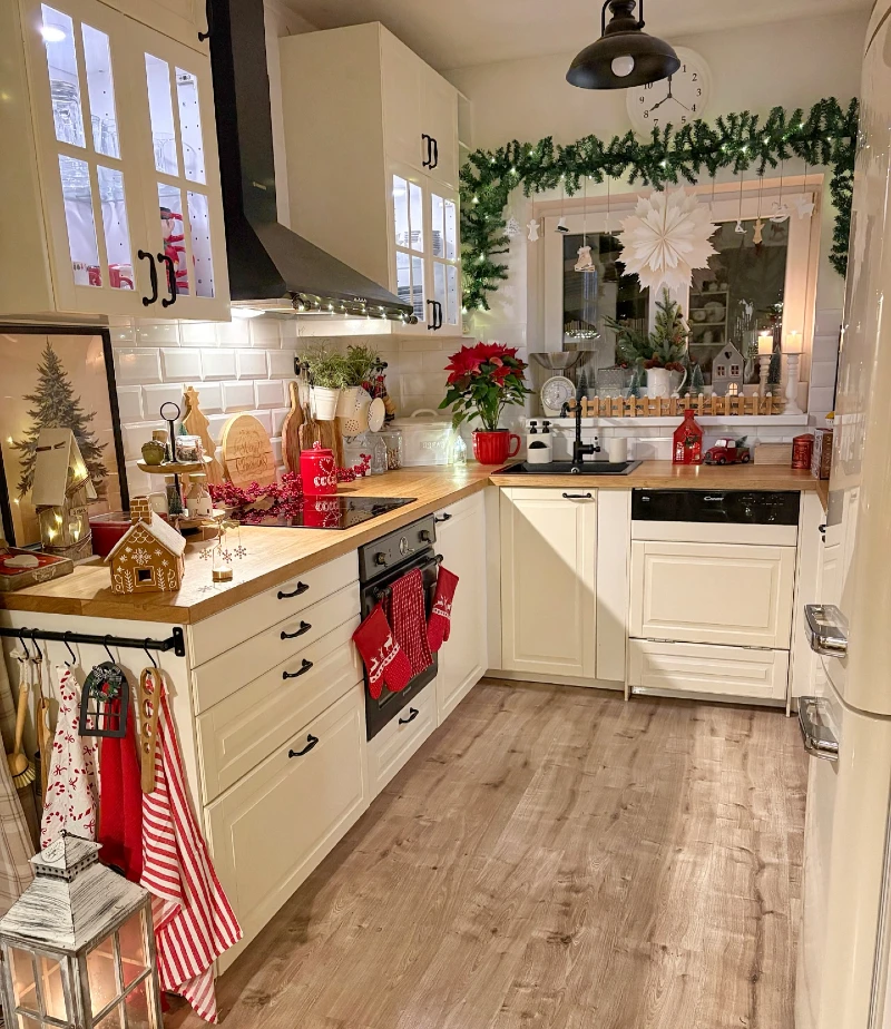 15. Cream Kitchen Window Garland with Red Towels and Candle Lantern Glow