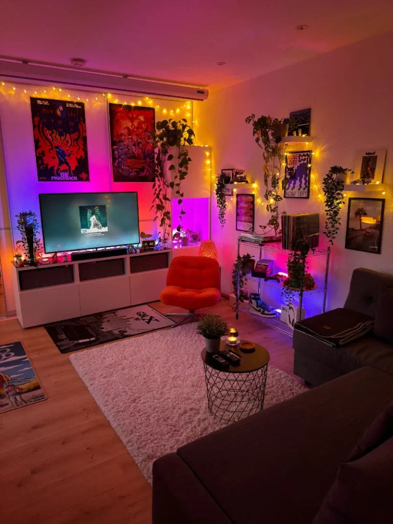 15. Pink Neon TV Corner with Orange Swivel Chair and Trailing Plants