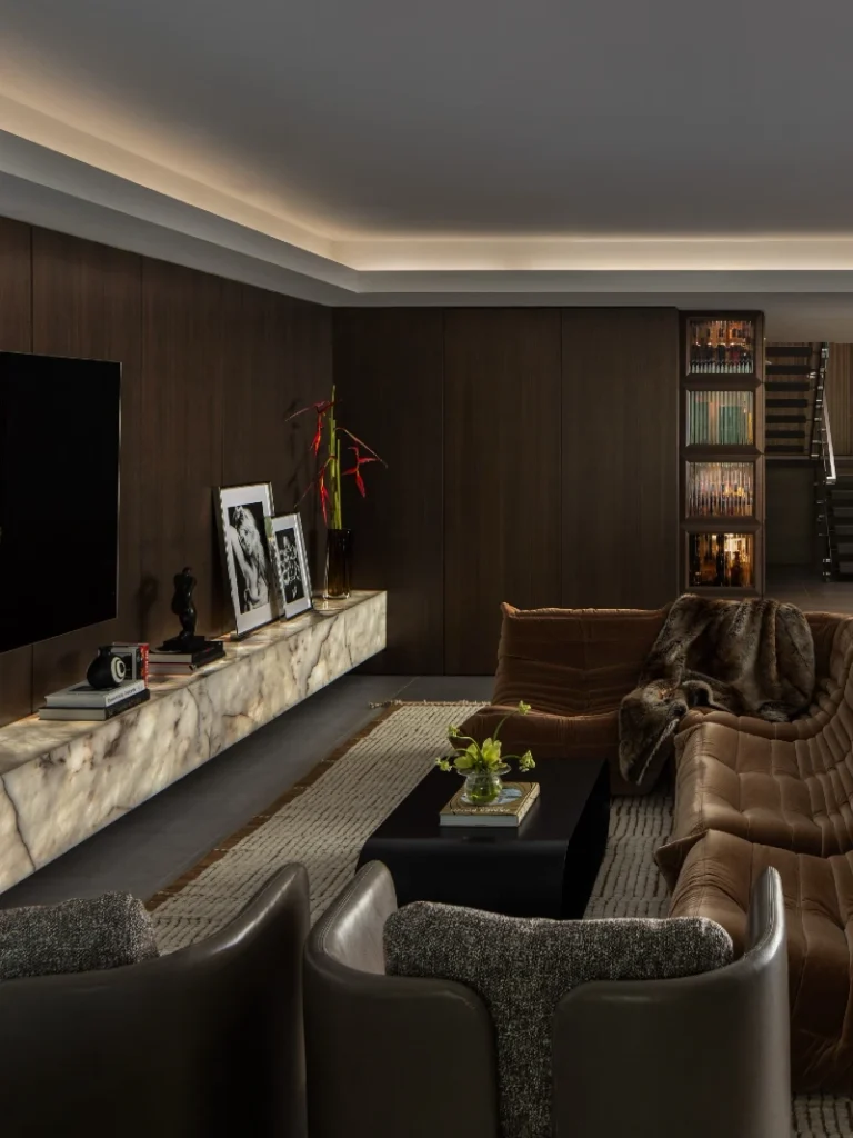 16. Dark Wood Media Wall with Glowing Stone Console and Brown Tufted Sectional