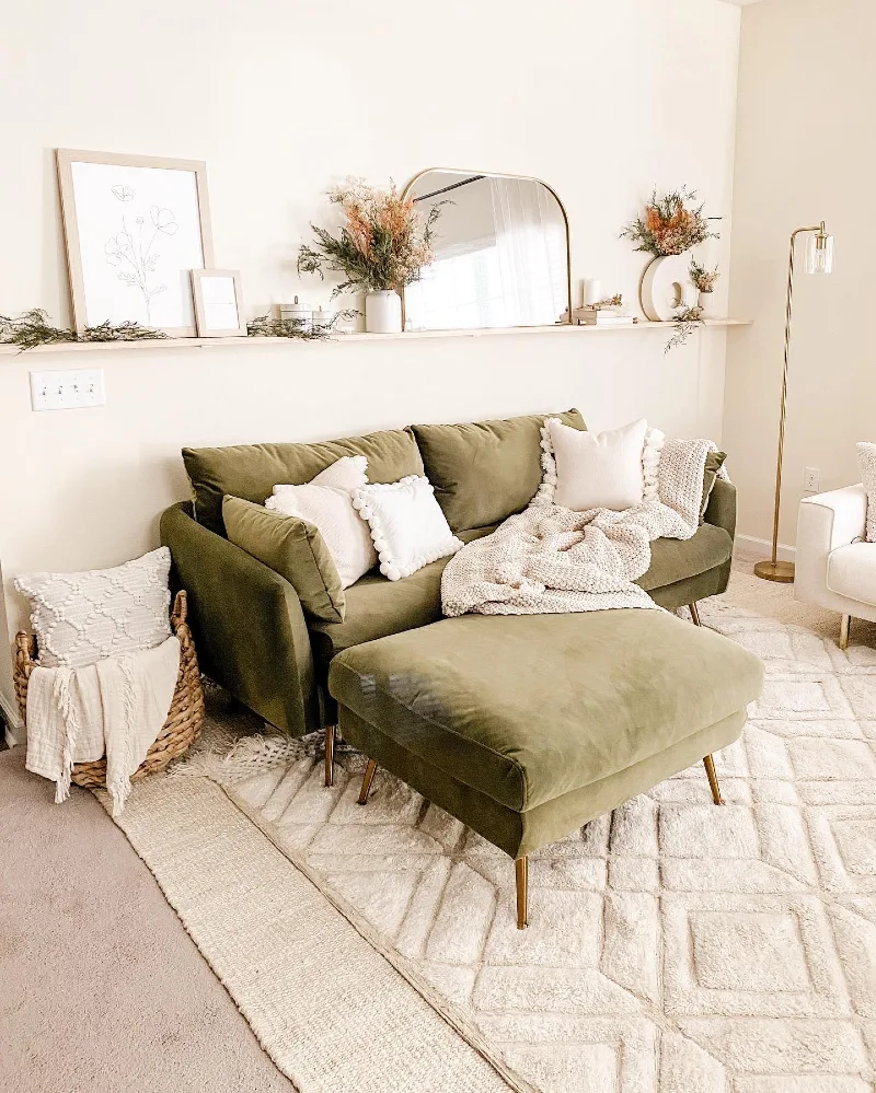 16. Long Sofa Shelf with Arched Mirror, Dried Florals, and Olive Green Seating