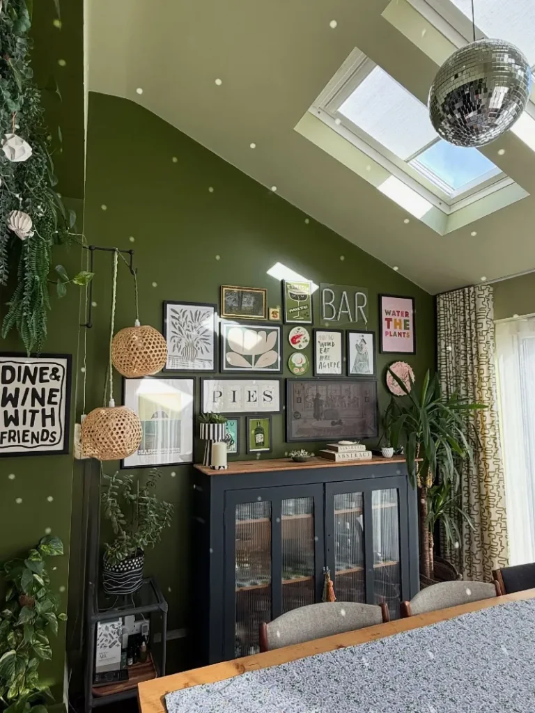 16. Olive Green Slanted Wall Gallery with Neon Signs and Mixed Frame Styling