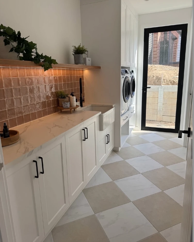 16. Taupe Checkerboard Laundry Floor with Terracotta Tile Backsplash