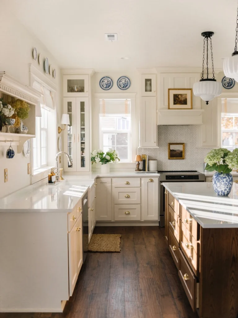 17. Colonial White Kitchen with Wood Island, Brass Details, and Blue Plate Wall Accents