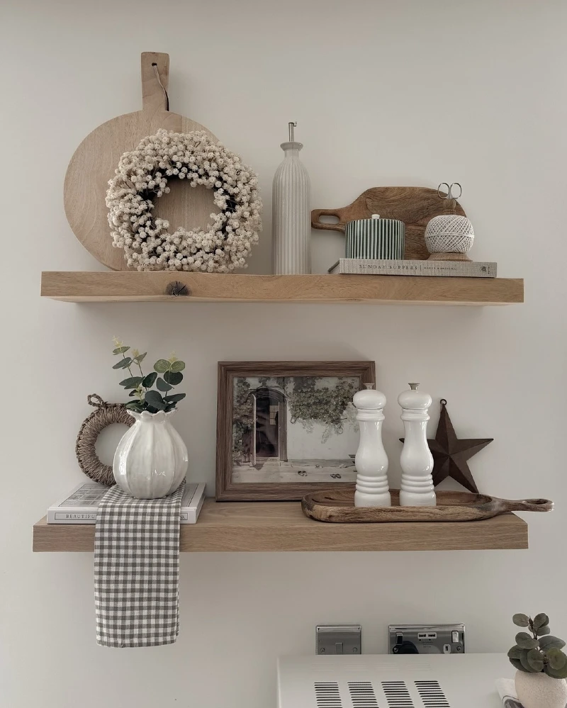 18. Farmhouse Kitchen Shelves with Wood Boards, White Wreath, and Gingham Towel