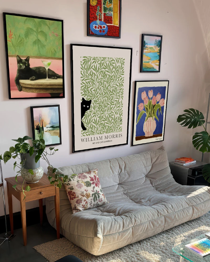 19. Eclectic Botanical Gallery Wall with Black Framed Art Above Minimal Sofa