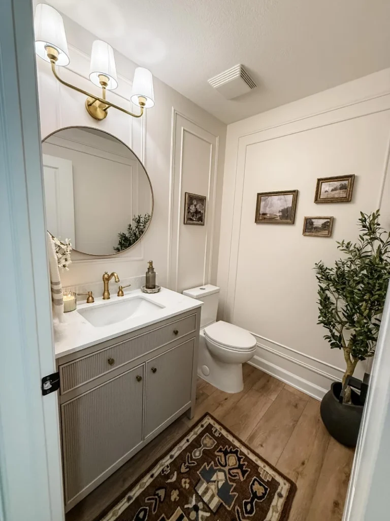 19. Paneled Neutral Bathroom with Vintage Gallery Wall