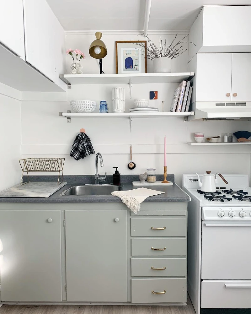 19. Soft Grey Cabinets with Brass Hardware and Open Shelf Gallery Styling
