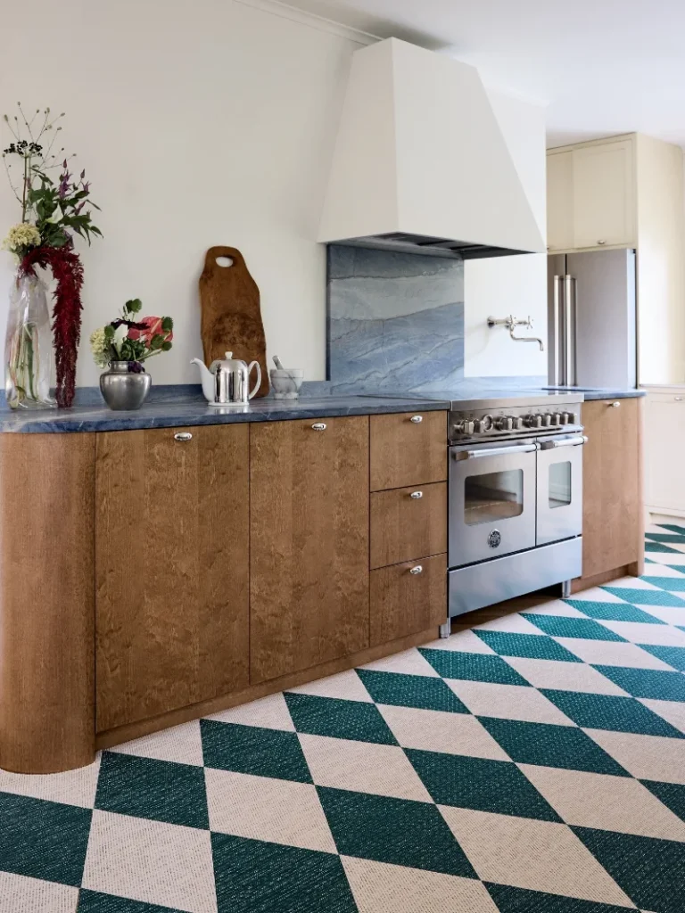 19. Teal Checkerboard Kitchen Floor with Warm Wood Cabinets and Blue Stone Counters