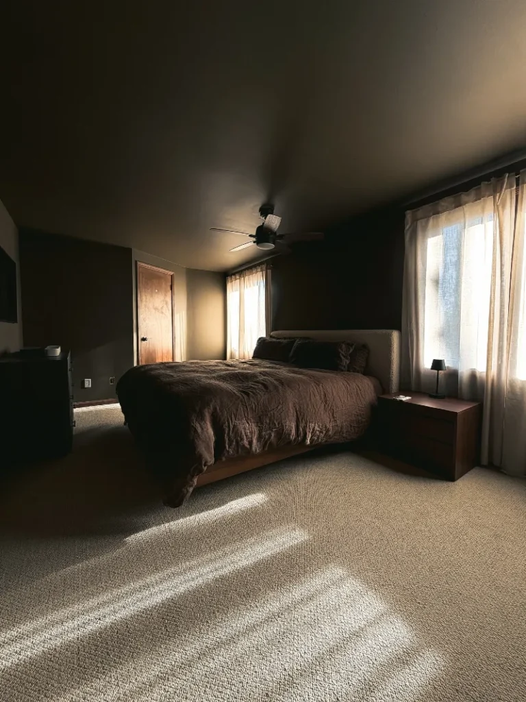 2. Dark Olive Bedroom with Brown Linen Bedding and Filtered Window Light