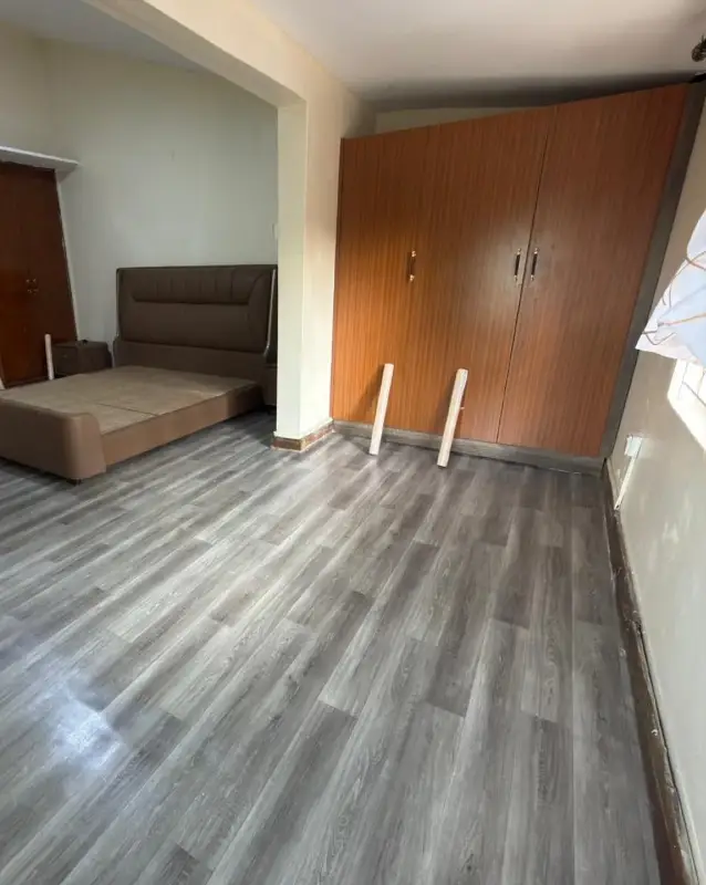 2. Gray Wood Look Plank Flooring with Warm Built In Wardrobes
