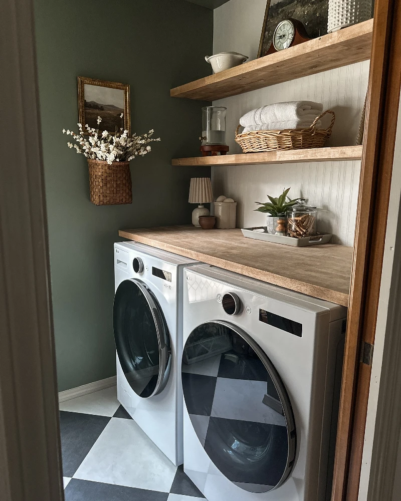 2. Olive Green Laundry Closet with Wood Counter, Wicker Basket, and Checkered Floor