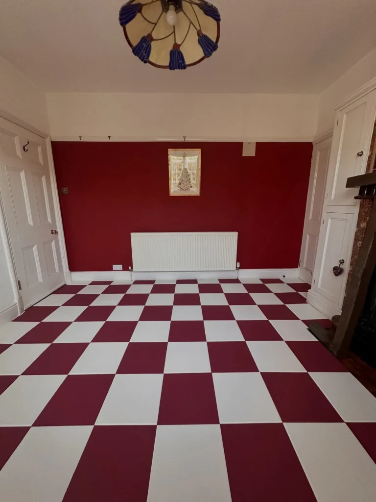 20. Burgundy and White Checkerboard Room with Red Feature Wall and Built In Cabinets