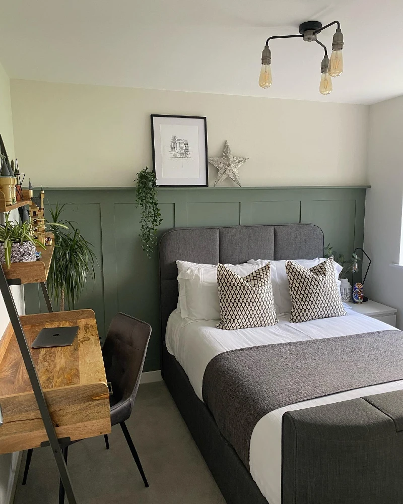 20. Sage Paneled Wall with Gray Upholstered Bed and Ladder Desk Shelf