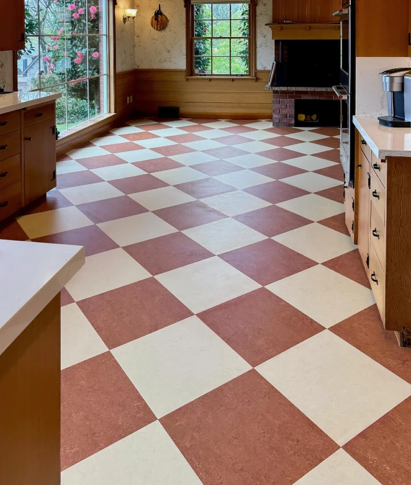 21. Terracotta Checkerboard Kitchen Floor with Honey Wood Cabinets and Brick Hearth