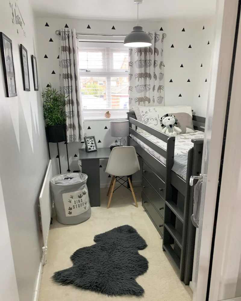 3. Charcoal Loft Bed with Deep Drawer Storage and Black Triangle Wall Decals