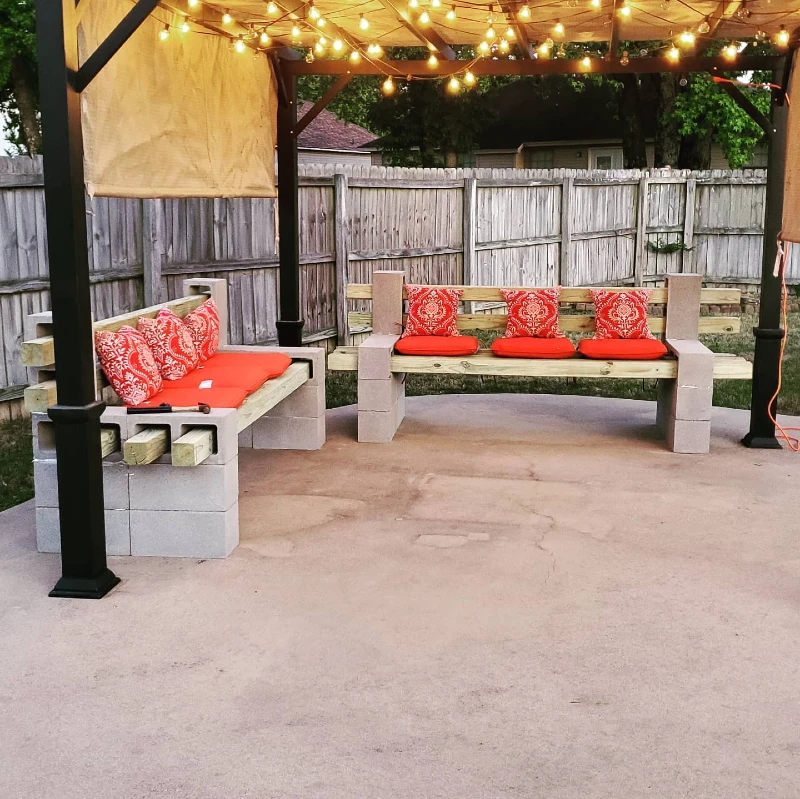 3. Cinder Block Corner Benches with Red Cushions Under String Lights
