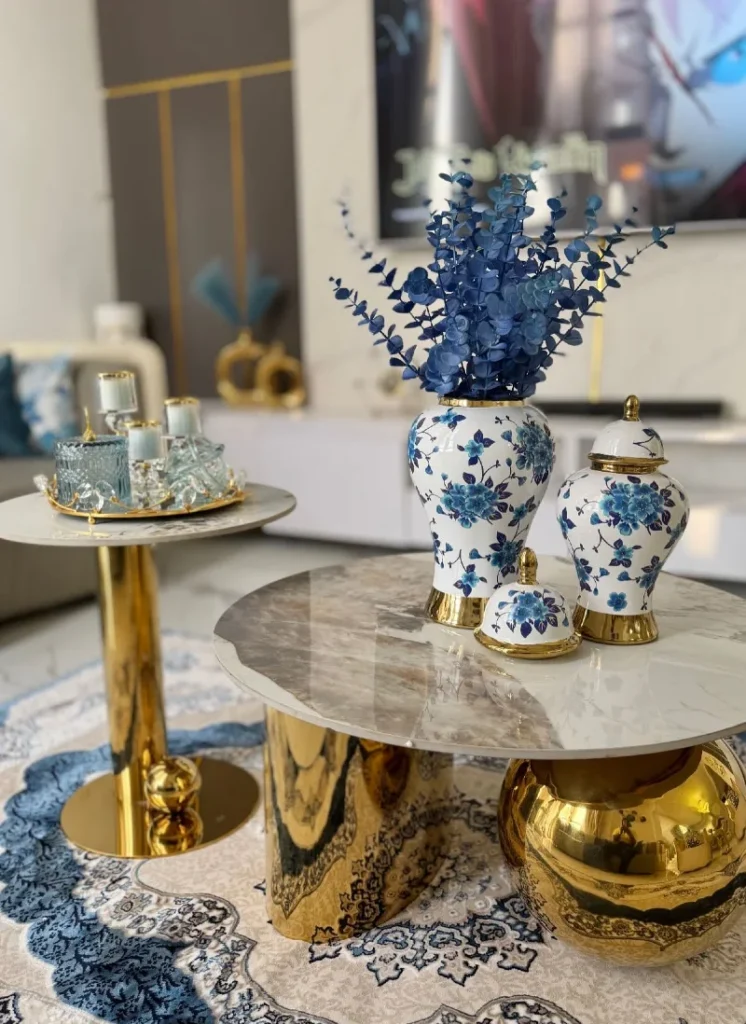 3. Marble Top Coffee Tables with Gold Bases and Blue Floral Ginger Jars