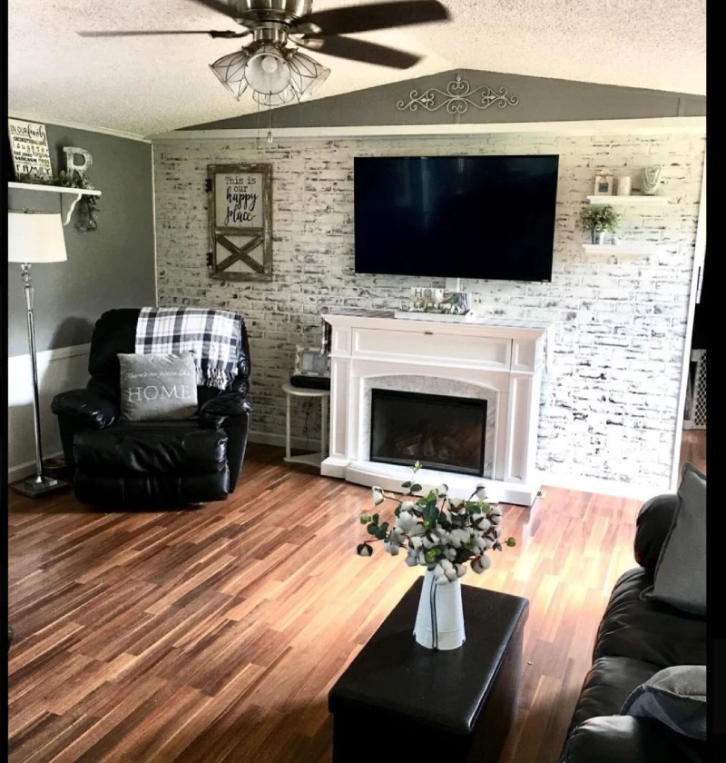 3. Whitewashed Brick TV Wall with Fireplace Mantel Styling