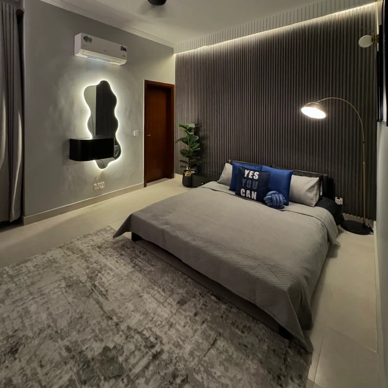 4. Gray Fluted Wall with Backlit Mirror and Low Platform Bed