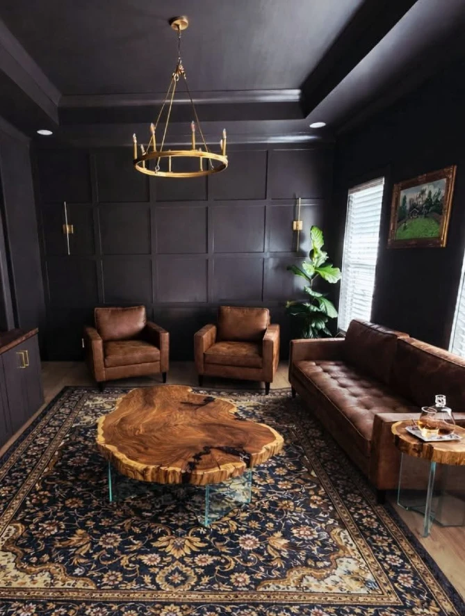 4. Live Edge Wood Slab Coffee Table with Brown Leather Seating and Black Paneled Walls