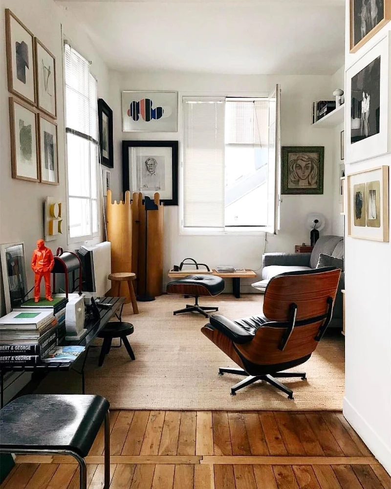 4. Mid Century Lounge Chair with Jute Rug, Framed Art, and Warm Wood Floors