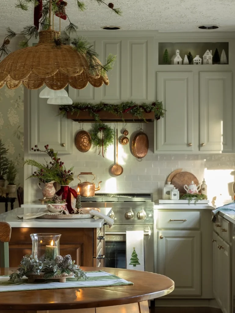 4. Soft Green Kitchen with Copper Pans, Woven Pendant, and Candlelit Garland