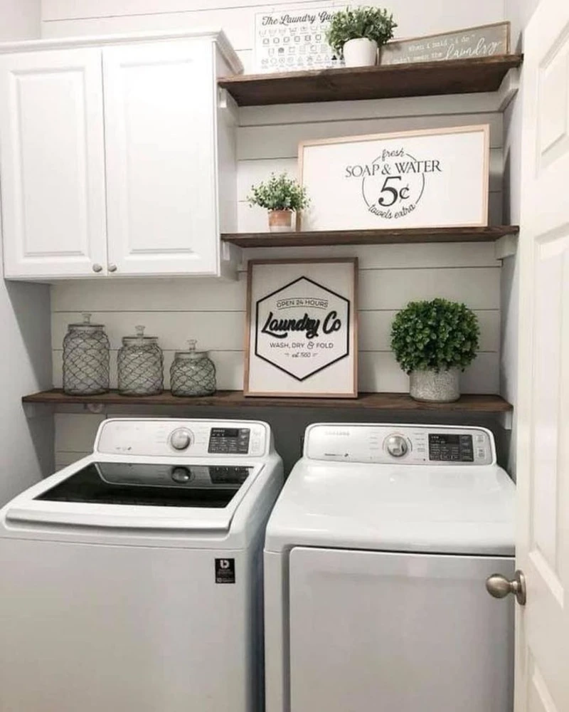 5. Farmhouse Laundry Wall with White Cabinet, Dark Wood Shelves, and Glass Storage Jars