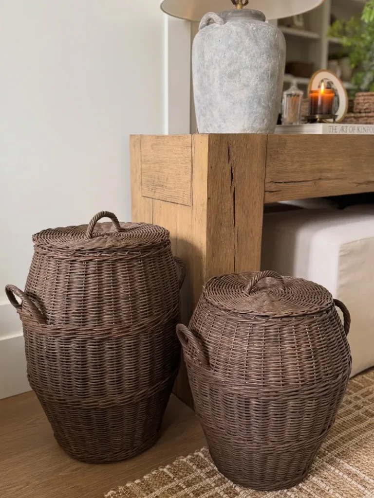 5. Lidded Wicker Baskets Beside a Raw Wood Console and Stone Lamp