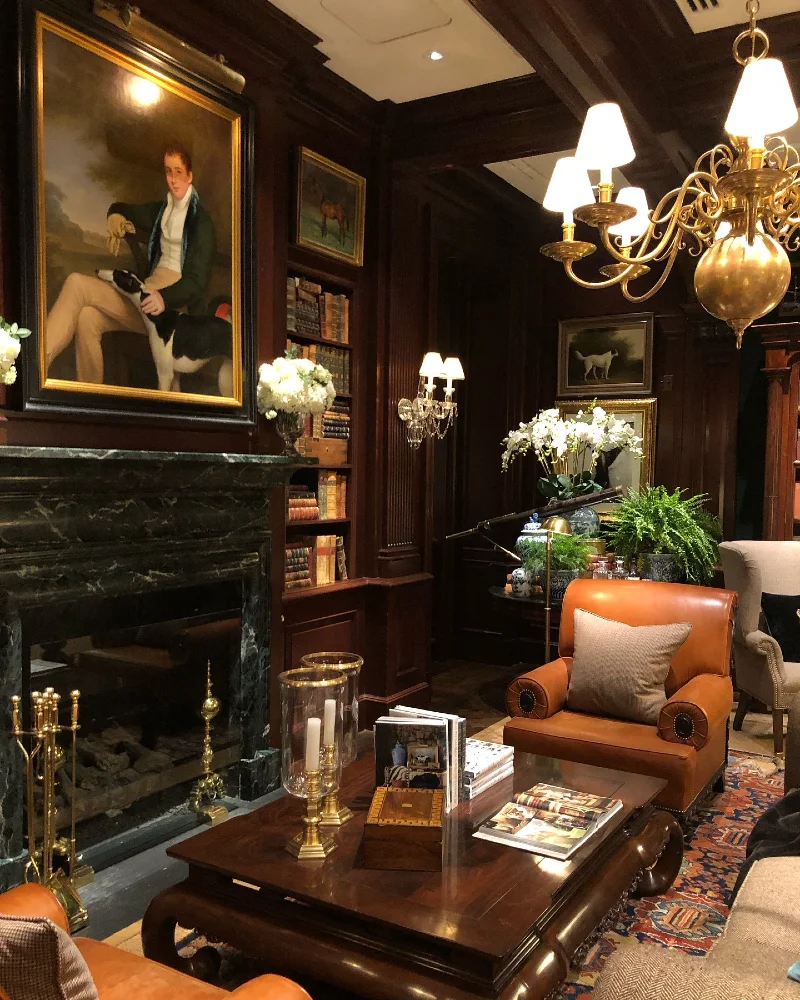 5. Mahogany Library with Marble Fireplace, Portrait Art, and Caramel Leather Chairs