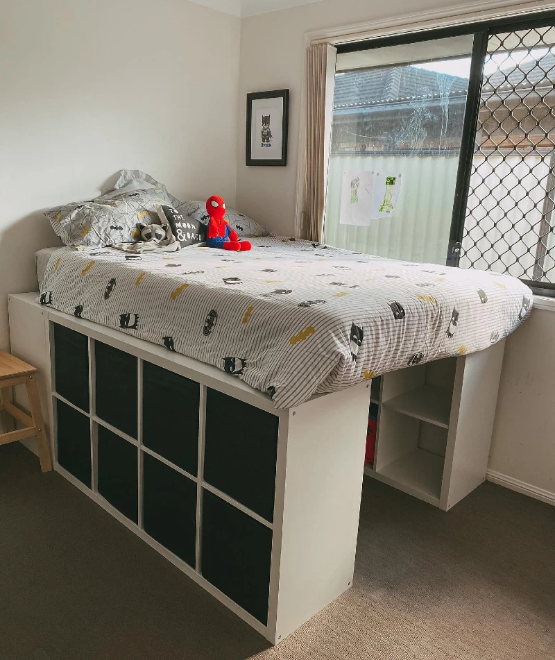 5. Raised White Cube Bed Base with Black Fabric Bins and Superhero Bedding