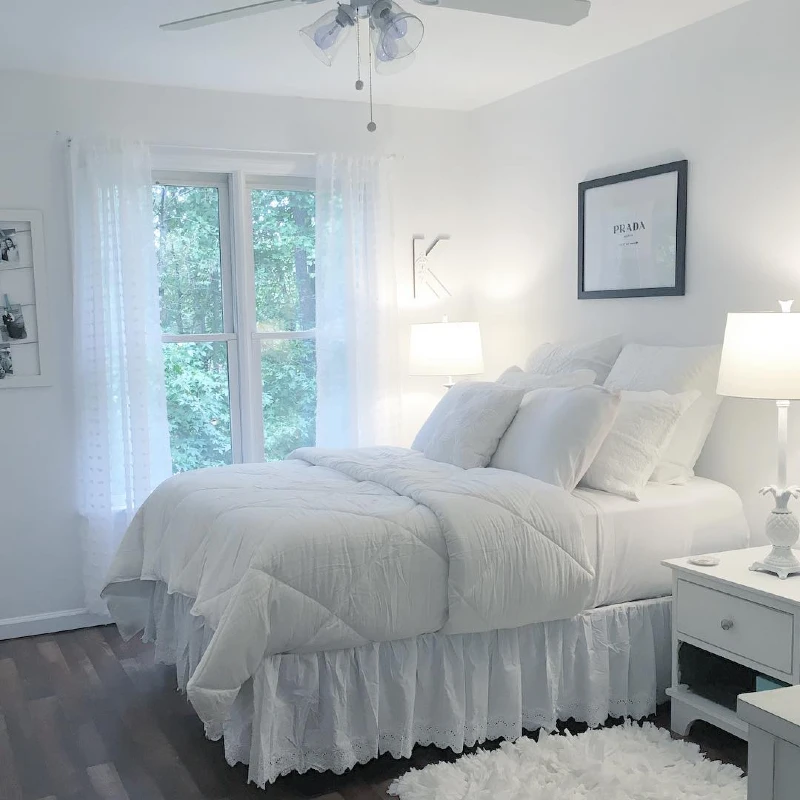 5. White Ruffled Bed Skirt with Sheer Curtains and Fluffy Rug