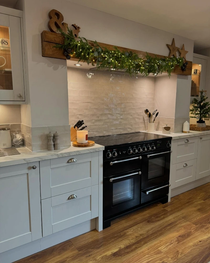 5. Wood Range Hood Garland with Star Accents and Black Range